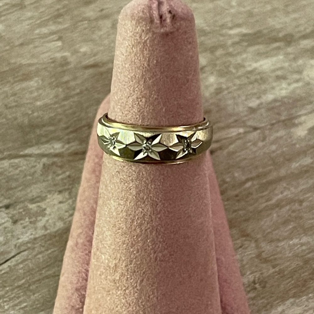 14k Gold and white wedding band with diamond accents.